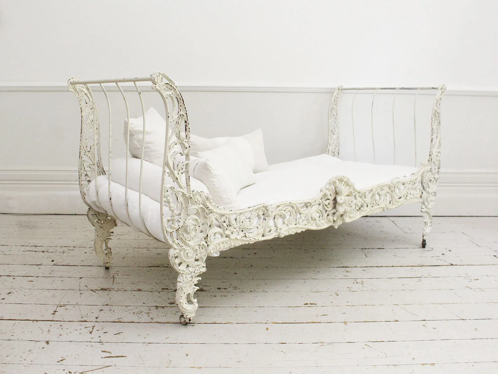 An Ornate 19th Century French Painted White Metal Daybed