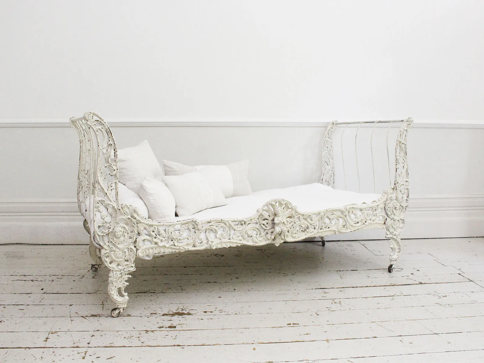 An Ornate 19th Century French Painted White Metal Daybed