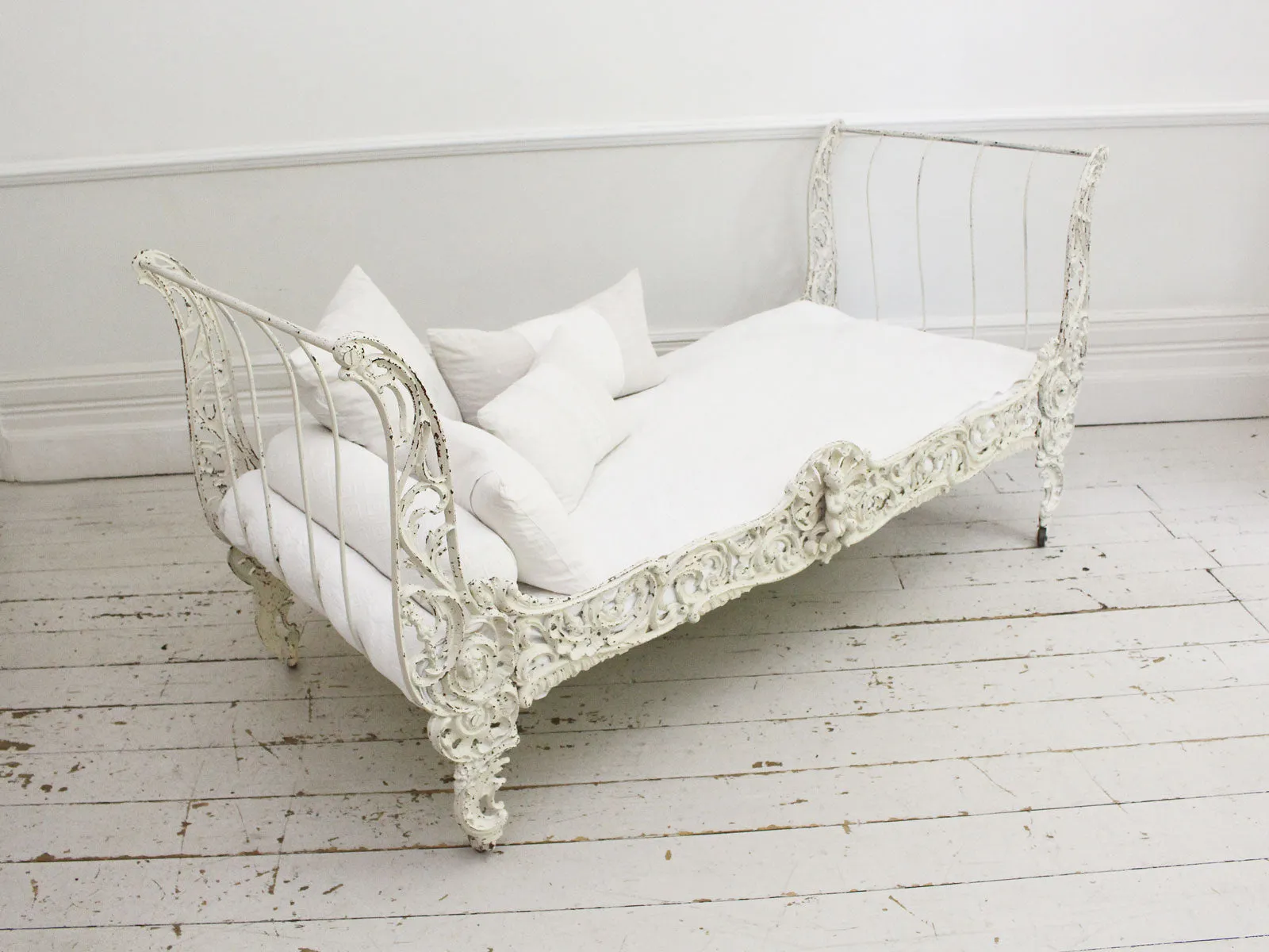 An Ornate 19th Century French Painted White Metal Daybed