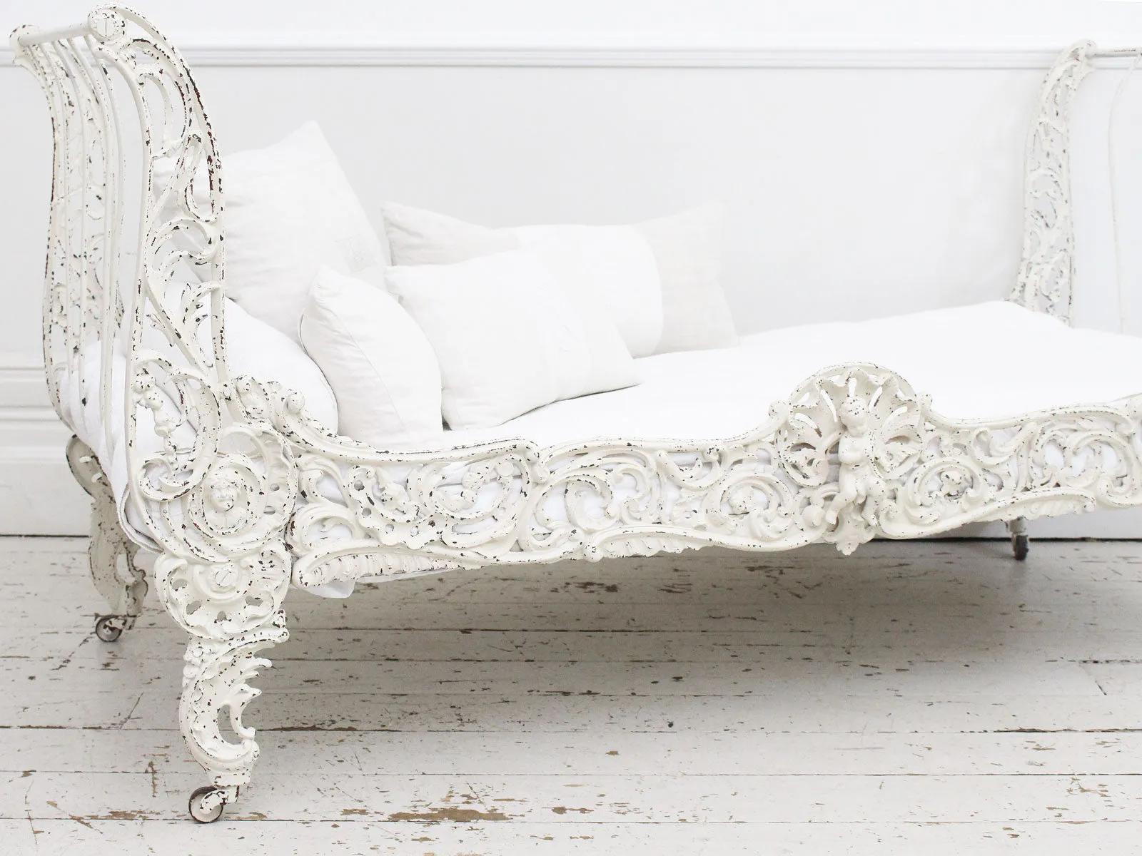 An Ornate 19th Century French Painted White Metal Daybed